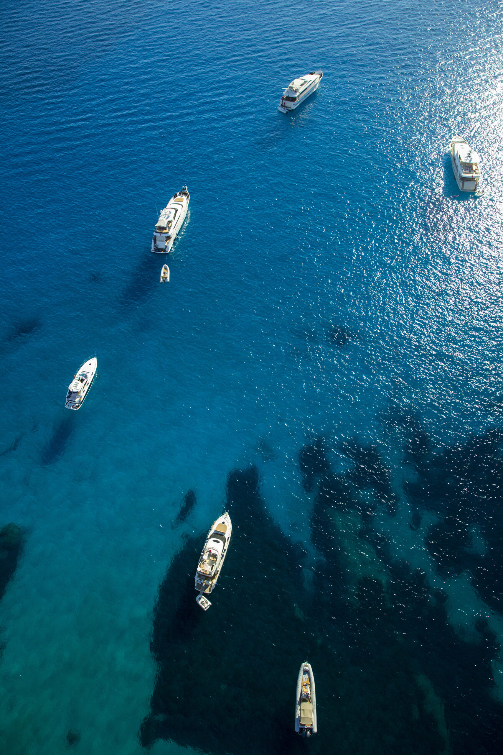 overhead view of yachts anchored in blue sea majo 2026 03 25 00 28 00 utc